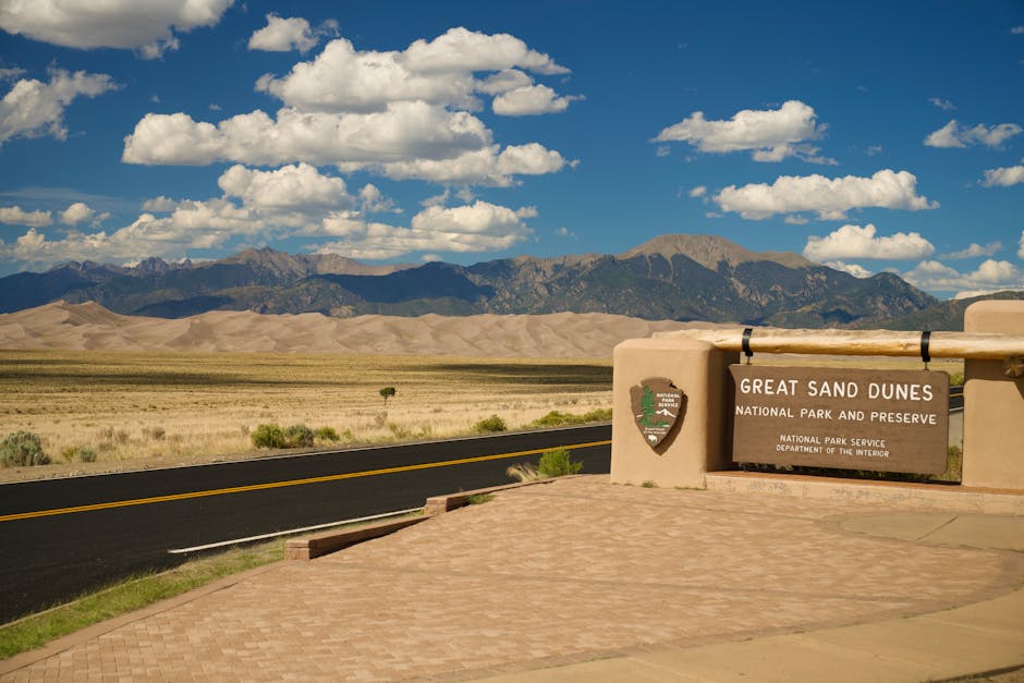 Experience the majestic Great Sand Dunes with mountains and clear skies in Colorado, USA.