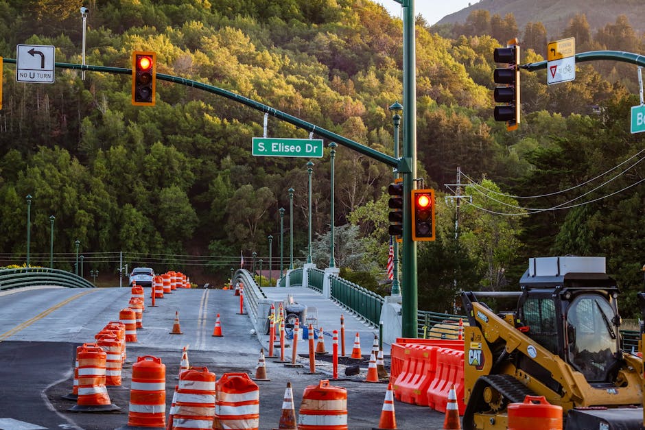 Busy road construction scene with traffic lights and signage on S. Eliseo Dr.