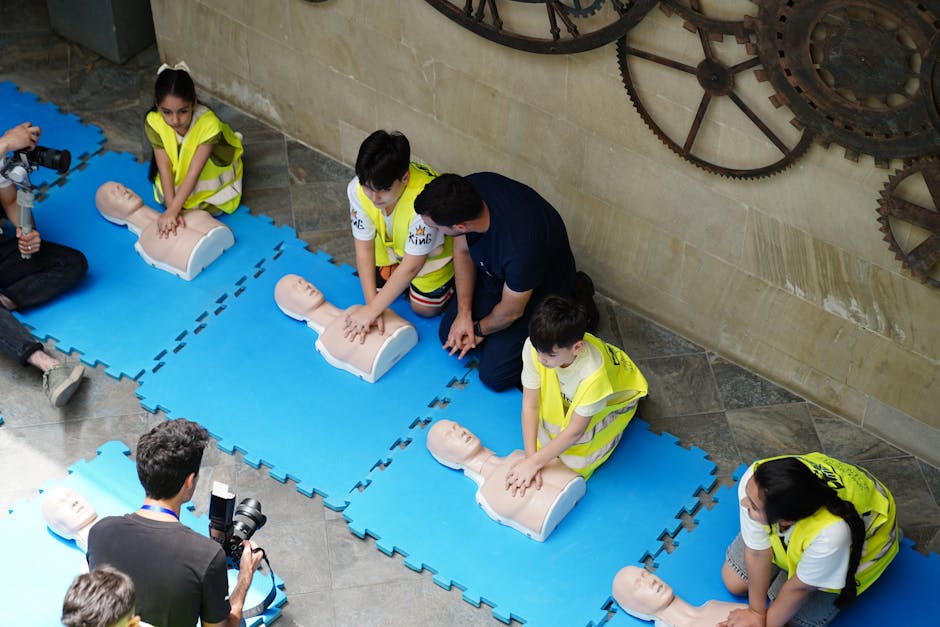 A CPR workshop in Baku, Azerbaijan featuring participants practicing on mannequins with guidance from an instructor.