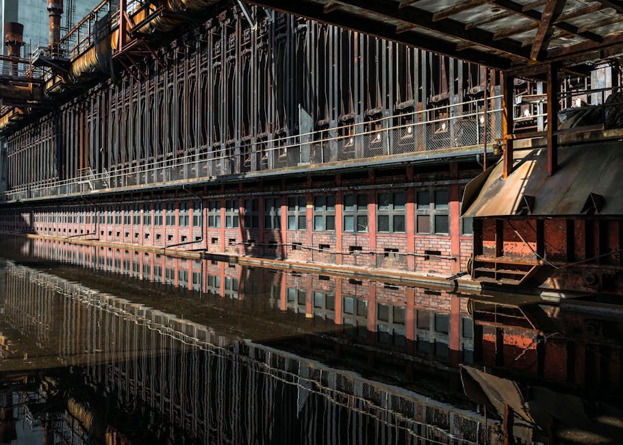 Reflection of the historic Zollverein Coal Mine Industrial Complex in Essen, Germany, showcasing industrial architecture.