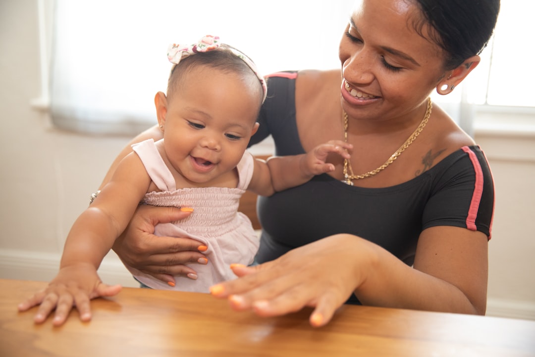 a woman holding a baby