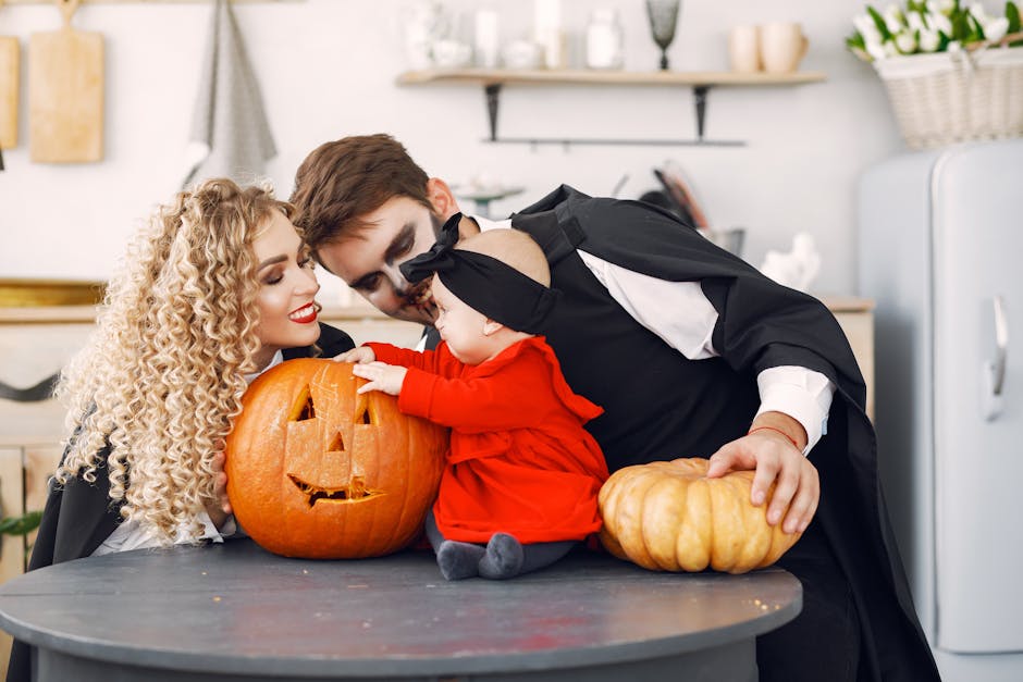 A family dressed in Halloween costumes enjoying together with carved pumpkins indoors.