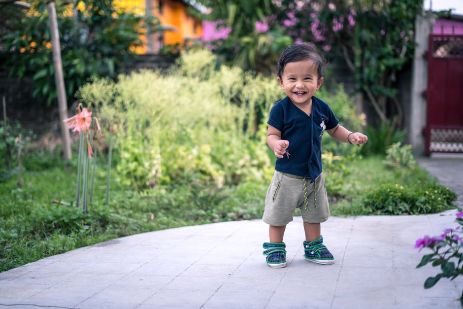 Happy toddler taking steps outdoors in a vibrant garden setting. (Photo: Pragyan Bezbaruah) Happy toddler taking steps outdoors in a vibrant garden setting.