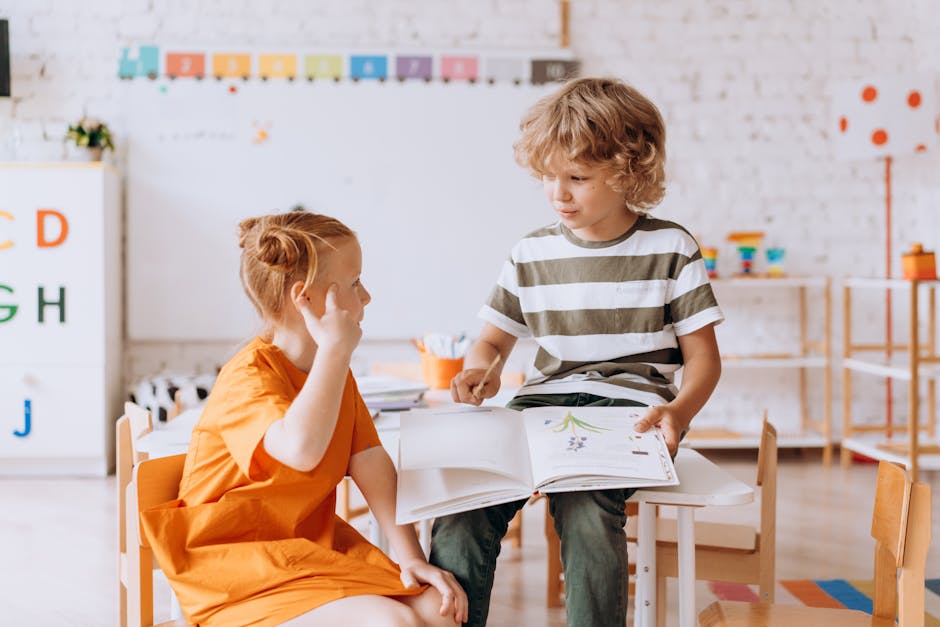 Two children engaged in reading and learning indoors at school.