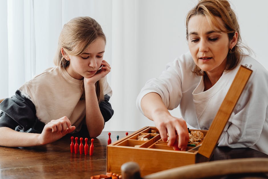 A mother and daughter enjoy a board game at the table, fostering family connection. (Photo: www.kaboompics.com) A mother and daughter enjoy a board game at the table, fostering family connection.
