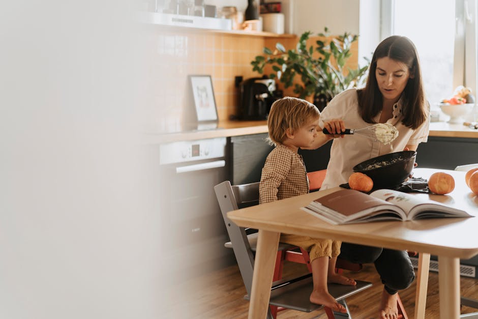 A mom and her child baking in a cozy kitchen surrounded by pumpkins. (Photo: olia danilevich) A mom and her child baking in a cozy kitchen surrounded by pumpkins.