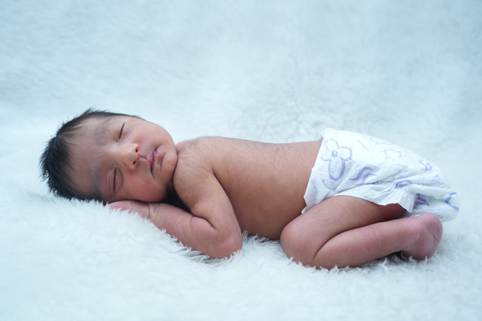 A serene newborn baby sleeping on a soft white blanket, capturing innocence and tranquility. (Photo: Prabhash Kumar) A serene newborn baby sleeping on a soft white blanket, capturing innocence and tranquility.